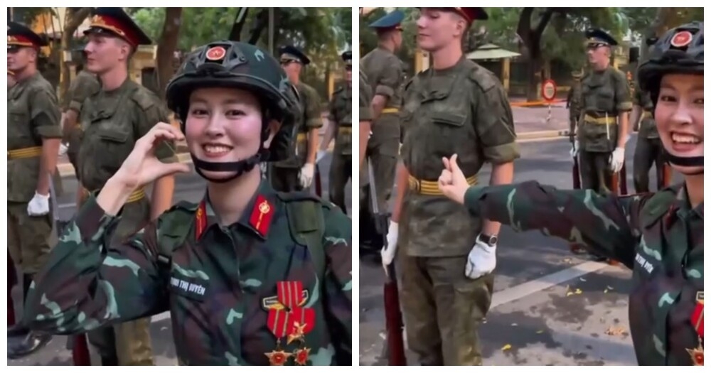
        Вьетнамская военнослужащая показала жест сердечко российскому солдату на параде    